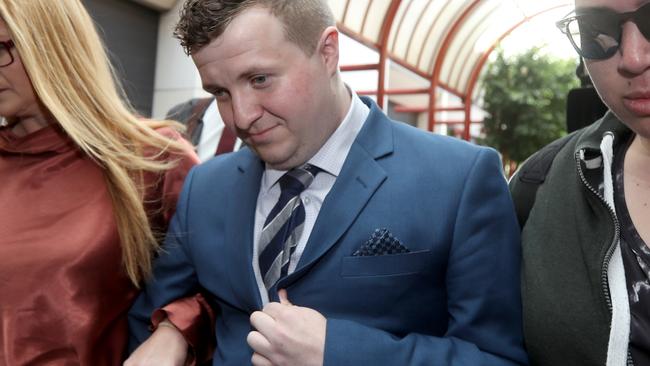 William Russell leaves the District Court with supporters. Picture: AAP/Kelly Barnes