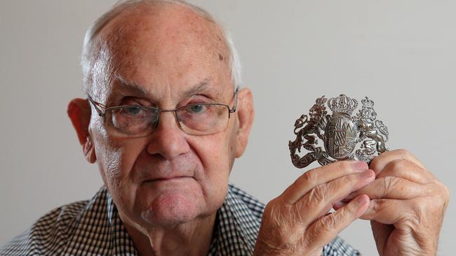 Gavin Elliott with the badge of a German killed by his uncle. Picture: Aaron Francis