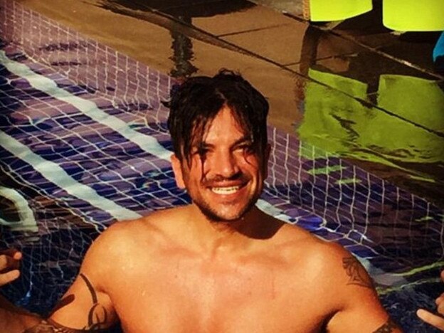 Cairns-bred popstar Peter Andre has posted a shirtless, poolside photo on social media to mark 20 years since the release of his chart-topper "Mysterious Girl".