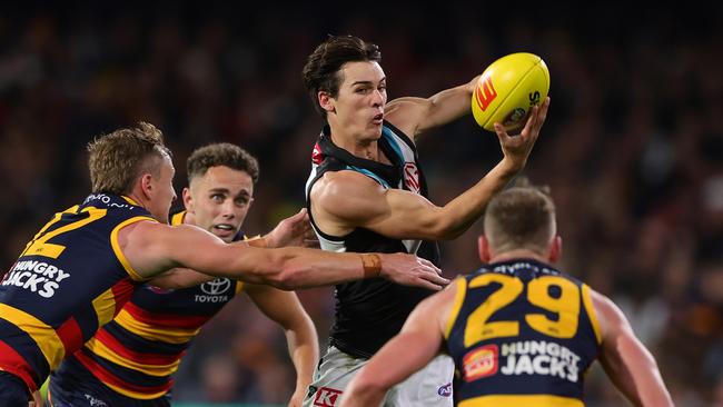 ADELAIDE, AUSTRALIA - MAY 02: Connor Rozee of the Power handpasses the ball during the 2024 AFL Round 08 match between the Adelaide Crows and the Port Adelaide Power at Adelaide Oval on May 02, 2024 in Adelaide, Australia. (Photo by Sarah Reed/AFL Photos via Getty Images)