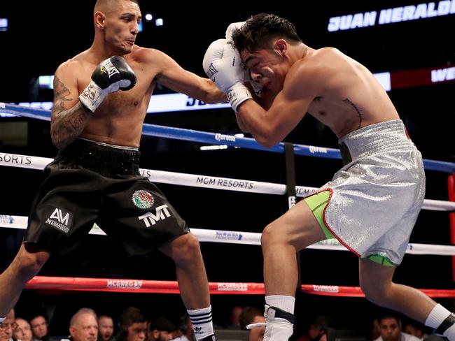 Juan Heraldez (left) throws a punch at Jose Borrego.