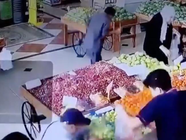 One of the explosions, at a fruit market, was caught on video.