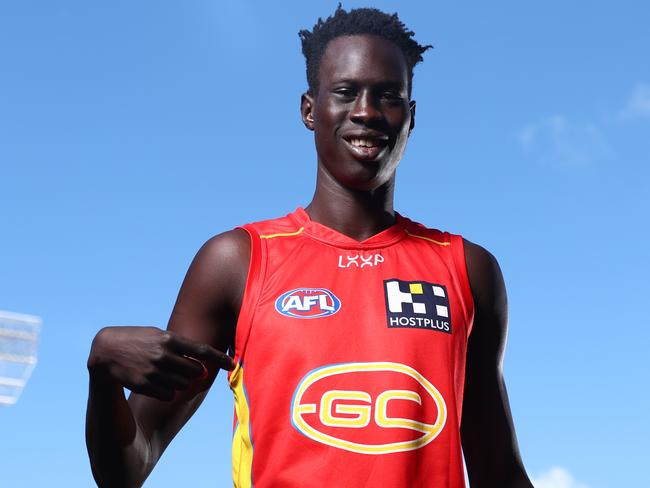 GOLD COAST, AUSTRALIA - SEPTEMBER 11: Mac Andrew poses during a media opportunity after re-signing with the Gold Coast Suns on September 11, 2024 in Gold Coast, Australia. (Photo by Chris Hyde/Getty Images)