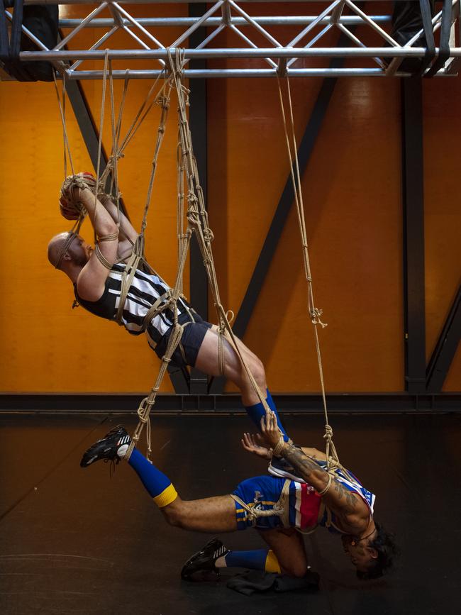 Still Lives, a performance art piece by Luke George and Daniel Kok, works with AFL players to capture a moment in time, bound by rope. Picture: Supplied