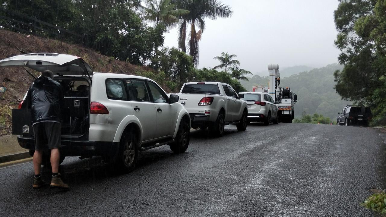 Vehicles of people stuck on Crest Hill Drive in Wongawallan after police asked residents to evacuate following a landslip caused by heavy rain. Picture: Jerad Williams.