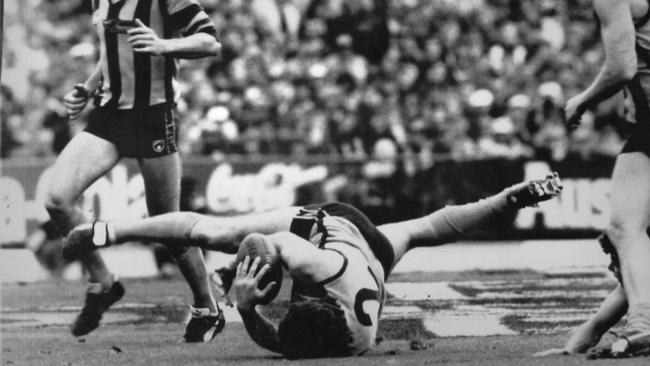 Chris Mew takes a diving mark in front of teammate Andrew Gowers at the Hawthorn vs. West Coast Eagles 1991 Grand Final match at Waverley Park.