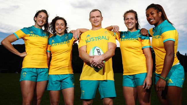 Outgoing sevens coach Tim Walsh (centre) with Australian players Alicia Quirk, Emilee Cherry, Evania Pelite and Ellia Green. Picture: Brett Costello