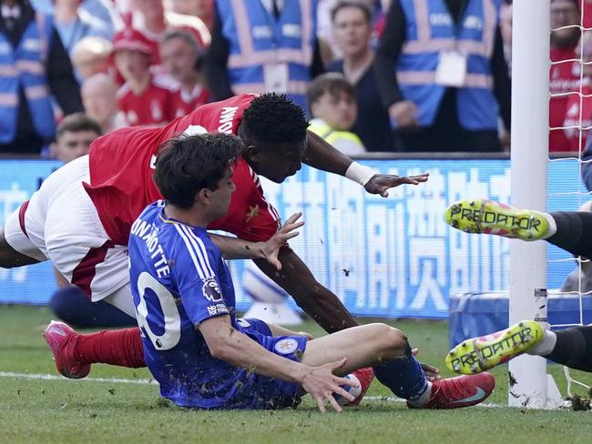 Nottingham Forest's Taiwo Awoniyi, left, and Leicester City's Facundo Buonanotte collide with the goalpost in the EPL. Picture: Jacob King/PA via AP