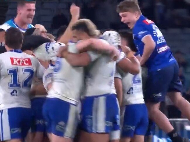 A young Bulldogs ball boy celebrates with the team