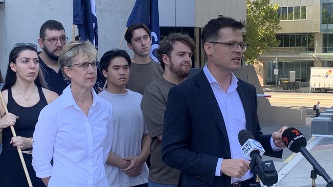 SDA SA secretary Josh Peak speaking in front of the Fair Work Commission with ACTU secretary Sally McManus. Picture: George Yankovich