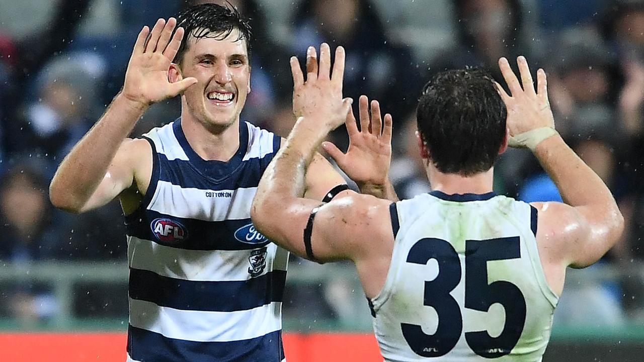 Charlie Constable celebrates with Patrick Dangerfield on Saturday night.