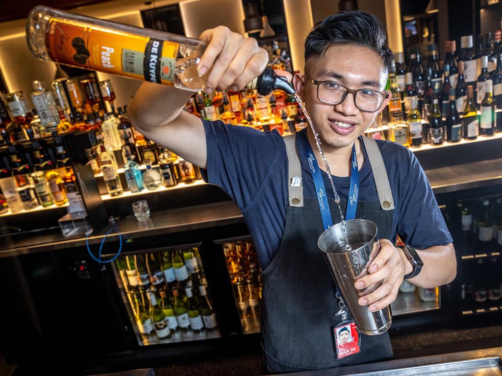 Erik Doung has taken up a second job as a bartender at Melbourne Airport to supplement his income. Picture: Jake Nowakowski