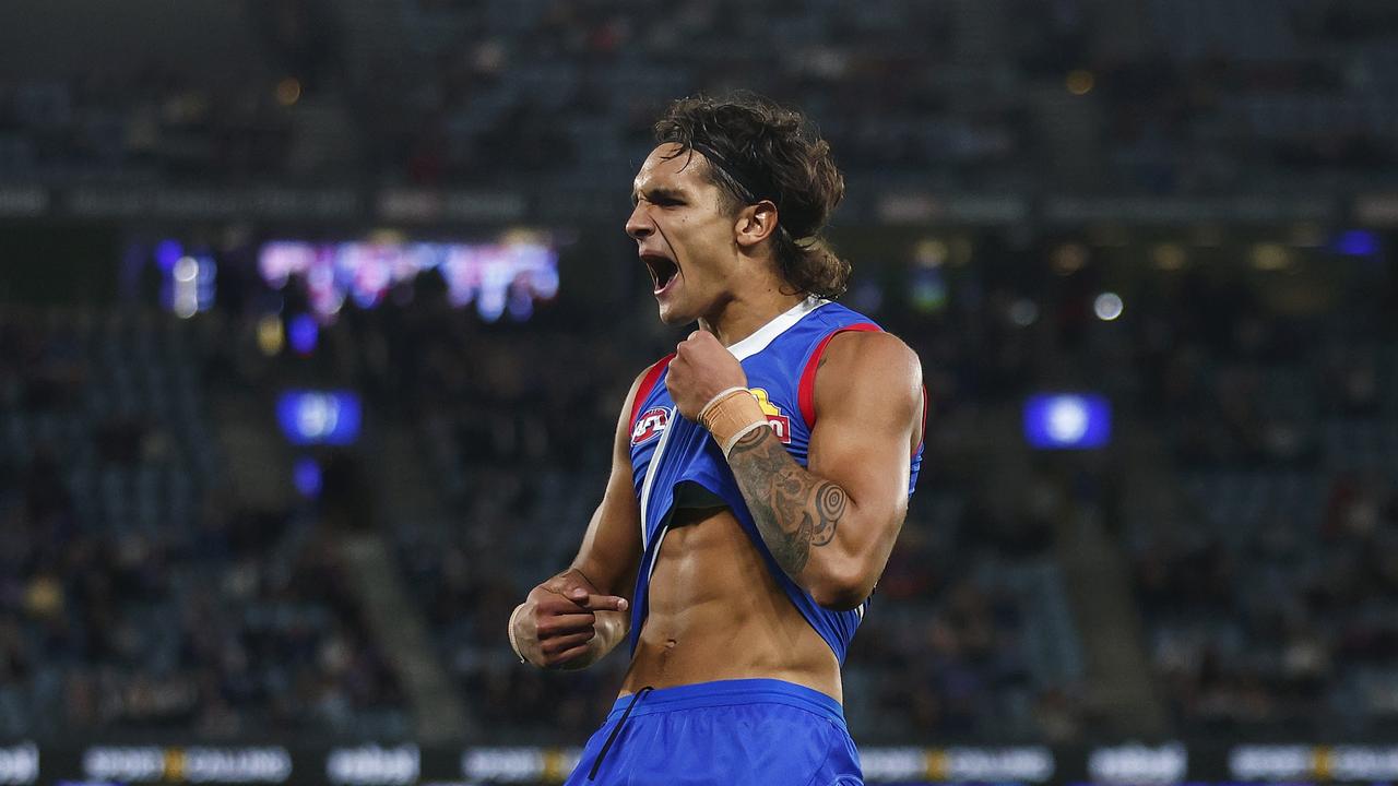 MELBOURNE, AUSTRALIA - MARCH 30: Jamarra Ugle-Hagan of the Bulldogs points to his skin as he celebrates kicking a goal during the round three AFL match between Western Bulldogs and Brisbane Lions at Marvel Stadium, on March 30, 2023, in Melbourne, Australia. (Photo by Daniel Pockett/Getty Images)