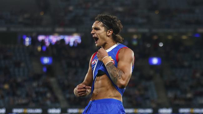 MELBOURNE, AUSTRALIA - MARCH 30: Jamarra Ugle-Hagan of the Bulldogs points to his skin as he celebrates kicking a goal during the round three AFL match between Western Bulldogs and Brisbane Lions at Marvel Stadium, on March 30, 2023, in Melbourne, Australia. (Photo by Daniel Pockett/Getty Images)