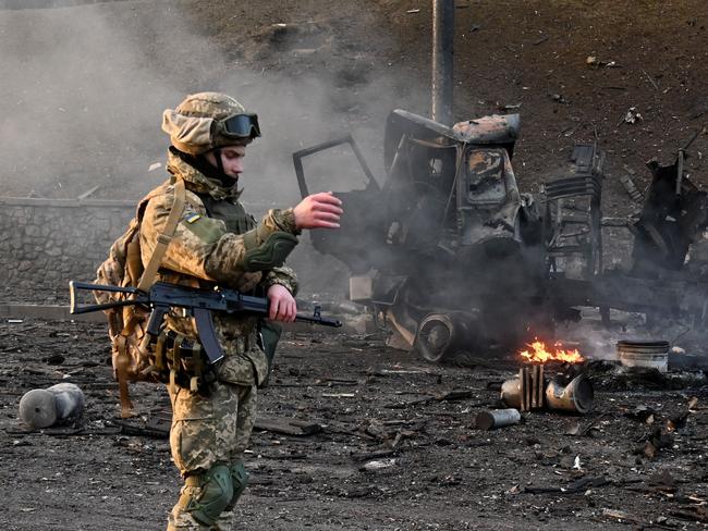 Ukrainian service members are seen at the site of a fighting with Russian raiding group in the Ukrainian capital of Kyiv. Picture: AFP