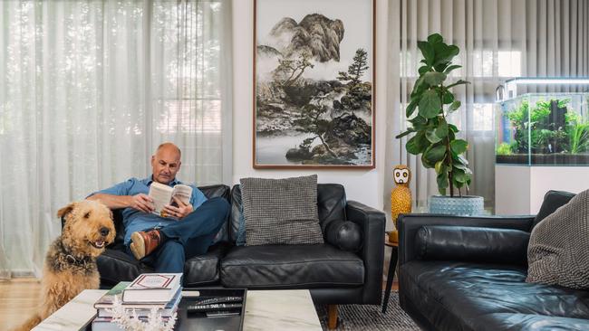 Jeffrey Morabito relaxes as one of the couple’s dogs steal the limelight. Picture: David Li