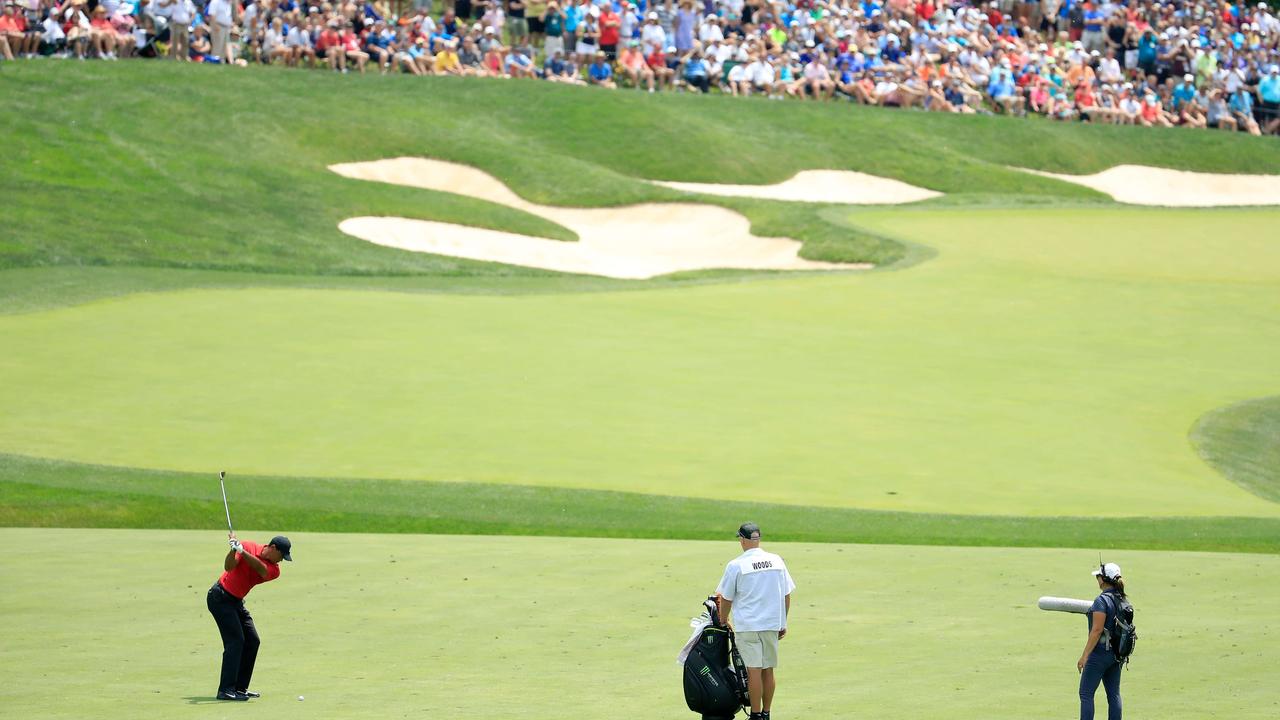 Tiger Woods hits his second shot on the 14th hole during the final round of The Memorial Tournament.