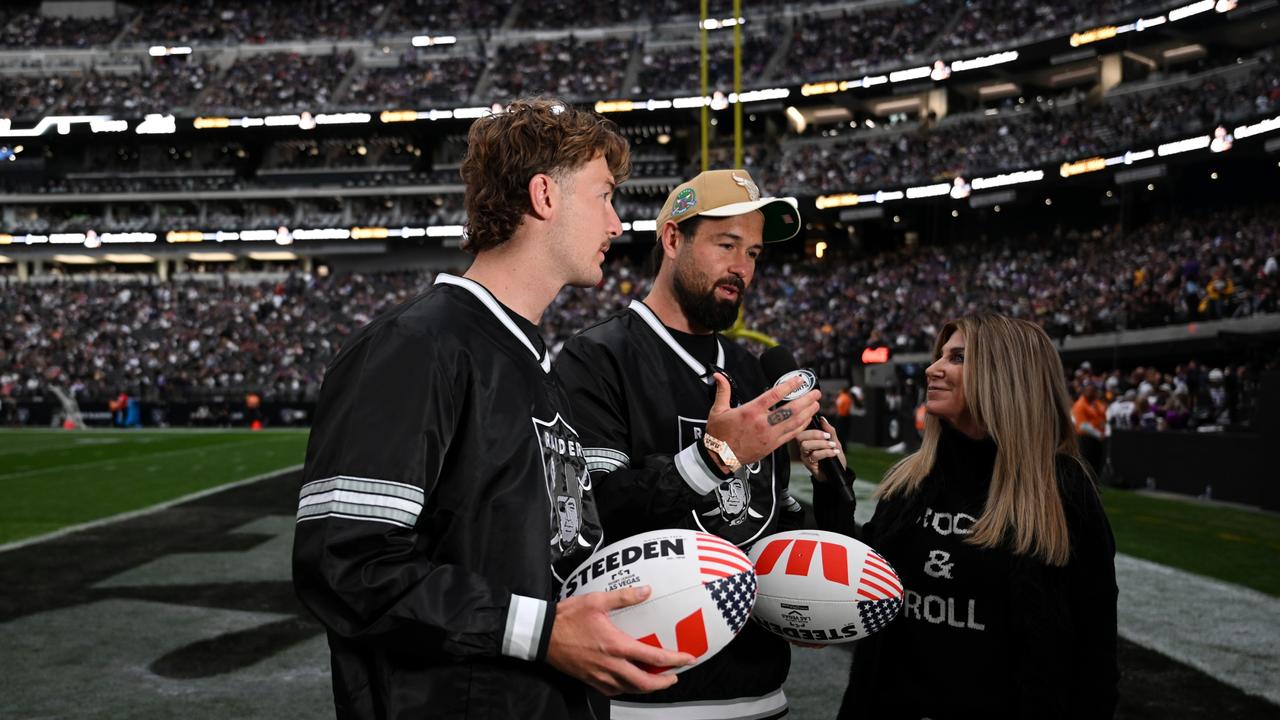 Campbell Graham and Aaron Woods are interviewed at halftime by Fox sideline commentator Laura Okmin. Photo: Grant Trouville/NRL Photos