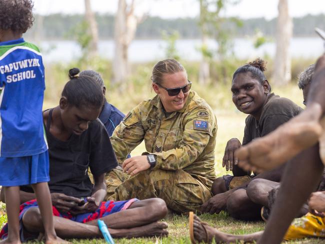 Gapuwiyak woman Jennifer Marrkula and Sgt Lisa Stone sitting together for the closing ceremony of AACAP in the community. Picture: Floss Adams