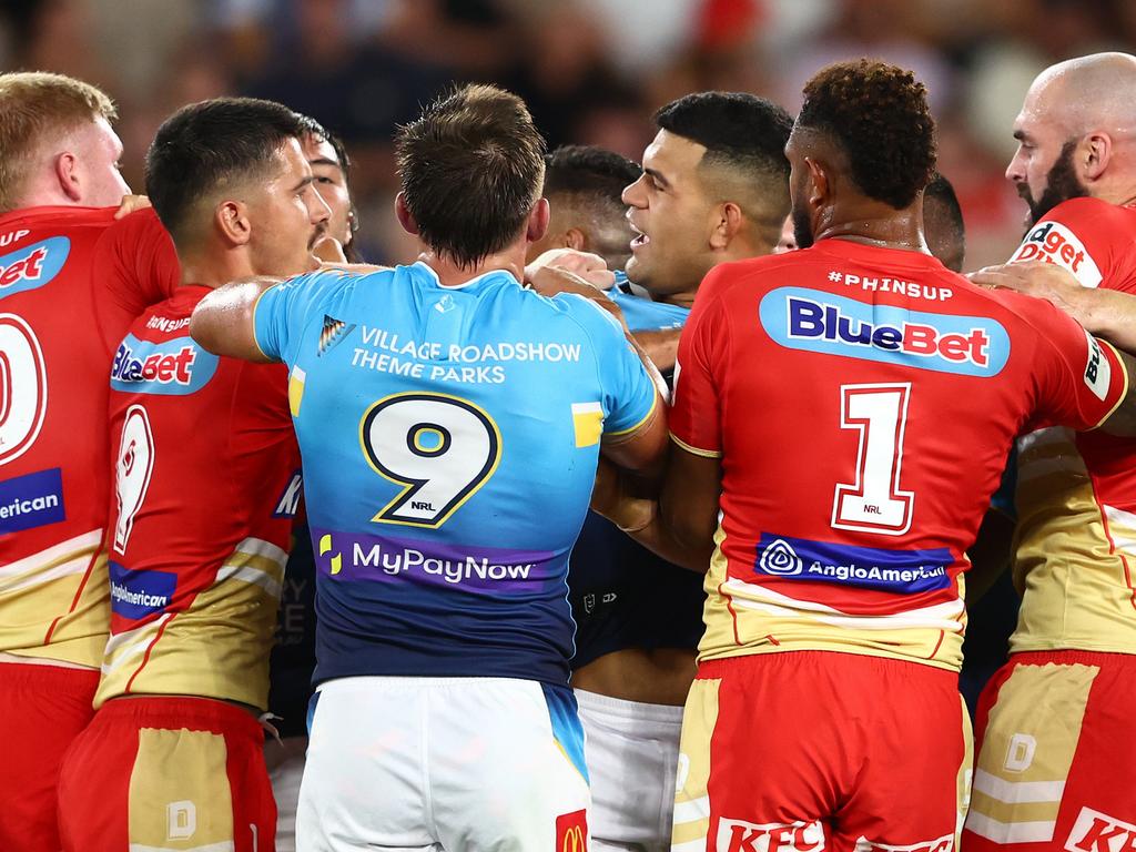 GOLD COAST, AUSTRALIA – MARCH 30: Players grapple during the round four NRL match between Gold Coast Titans and Dolphins at Cbus Super Stadium, on March 30, 2024, in Gold Coast, Australia. (Photo by Chris Hyde/Getty Images)