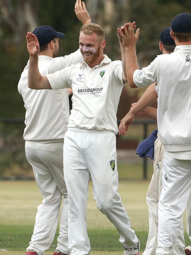 Dayne Smith celebrates a wicket for Plenty Valley. Picture: Hamish Blair