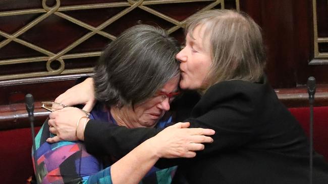 Victorian Greens MPs Colleen Hartland (left) and Samantha Dunn react as the state's assisted dying bill passes the upper house in 2017.