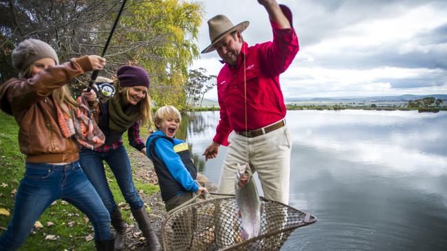 A family enjoys fishing at the Tuki Trout Farm at Smeaton. Picture: Supplied