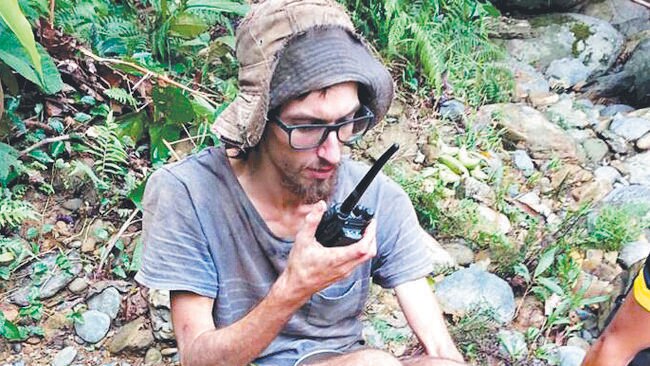 Andrew Gaskell talks to his father to tell him that he is alive, after being found in the Malaysian jungle. Picture: SARAWAK FIRE AND RESCUE