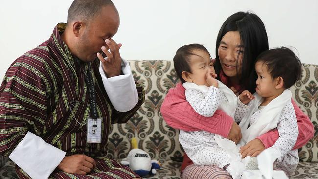 Nima and Dawa Pelden and mum Bhumchu Zangmo are reunited with father Sonam Tshering in Bhutan. Picture: Alex Coppel