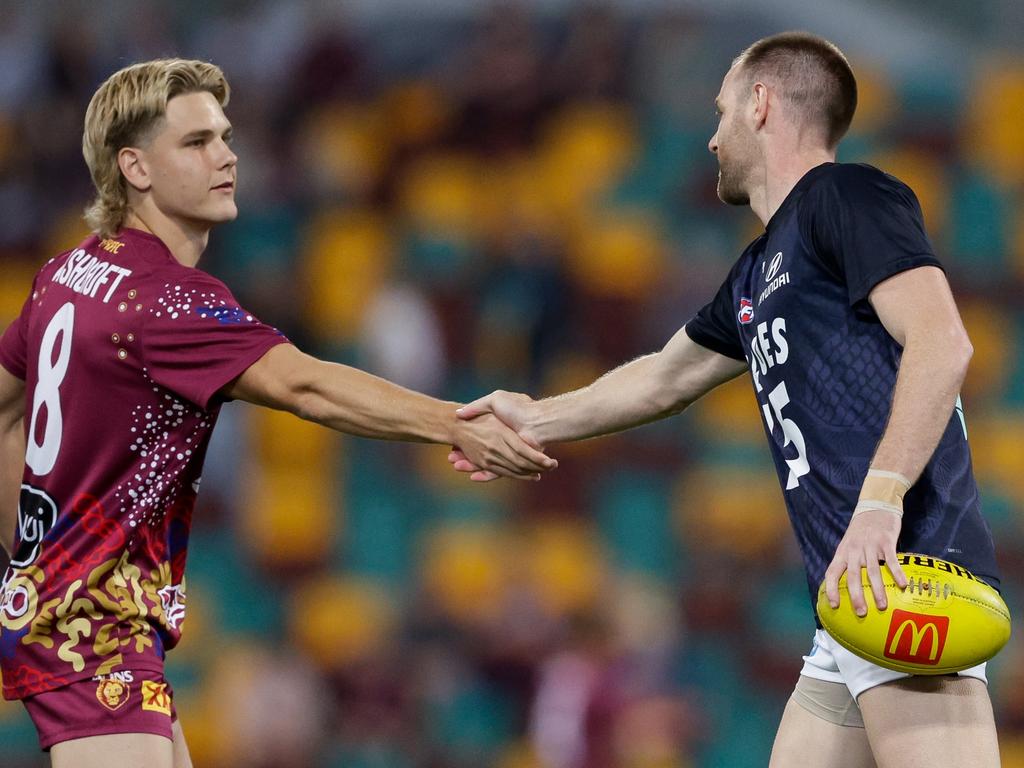 Sam Docherty and Will Ashcroft of the Lions shake hands prior to the elimination final. (Photo by Russell Freeman/AFL Photos via Getty Images)