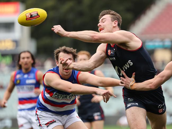 Harry Boyd from Norwood handballs during the SANFL semi-final match between Norwood and Central Districts at Adelaide Oval in Adelaide, Sunday, September 8, 2024. (SANFL Image/David Mariuz)