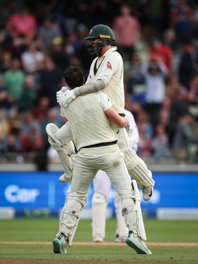 Pat Cummins of Australia and Nathan Lyon celebrate.