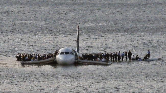 Passengers wait to be rescued on the wings of a US Airways Airbus 320 jetliner that safely ditched in the Hudson River in New York, thanks to the skill and quick thinking of captain Chesley Sullenberger.