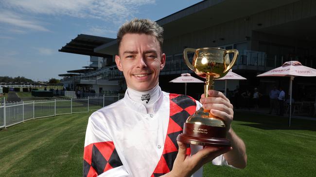 Melbourne Cup winning jockey Robbie Dolan with the Cup trophy at Ipswich on Thursday Picture: Liam Kidston