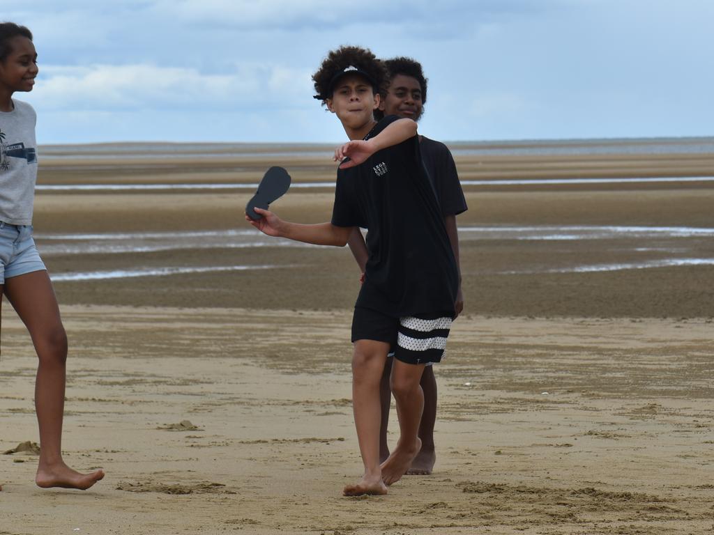 Harper Davis playing thong-throwing at the Mackay & District South Sea islander Association's 2022 Australia Day Celebrations in Quota Park. Picture: Lillian Watkins