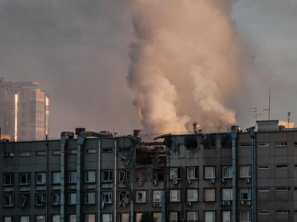 Smoke rises from a partially destroyed building in Kyiv on October 17, 2022, exactly one week after Russia’s strikes on major civilian areas. (Photo by Yasuyoshi CHIBA / AFP)