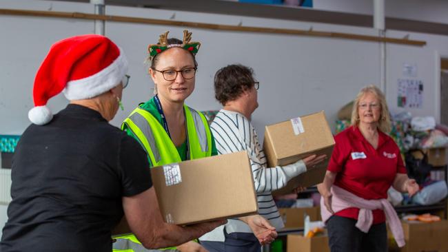 Volunteers bringing donations in a convoy at Hobart City Mission in Moonah. Picture: Linda Higginson