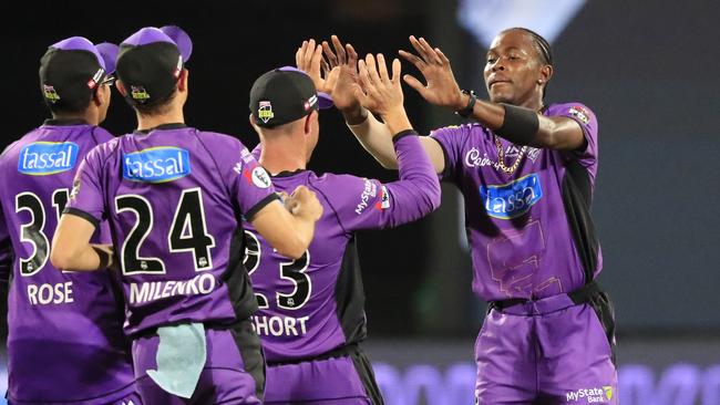 Jofra Archer of the Hurricanes (right)) is congratulated on the wicket of Marcus Harris of the Renegades during the Big Bash League (BBL) match between the Hobart Hurricanes and the Melbourne Renegades at Blundstone Arena in Hobart, Thursday, February 7, 2019. (AAP Image/Rob Blakers)