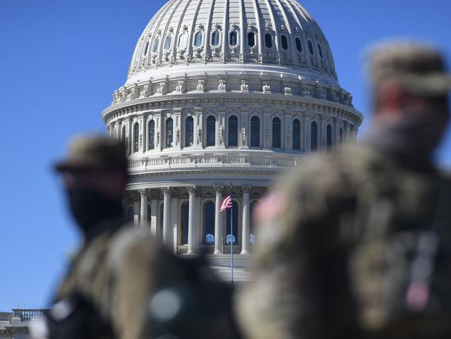 Members of the National Guard are seen patrolling near the US Capitol Building on Capitol Hill on March 3, 2021, in Washington, DC. - Police said March 3, 2021 they have bolstered security in Washington after intelligence uncovered a "possible plot to breach the Capitol" on March 4, a day that holds significance for conspiracy-believing supporters of former president Donald Trump. "We have obtained intelligence that shows a possible plot to breach the Capitol by an identified militia group on Thursday, March 4," the US Capitol Police said in a statement on Twitter, nearly two months after a deadly riot by Trump supporters shook the citadel of American democracy. (Photo by Eric BARADAT / AFP)