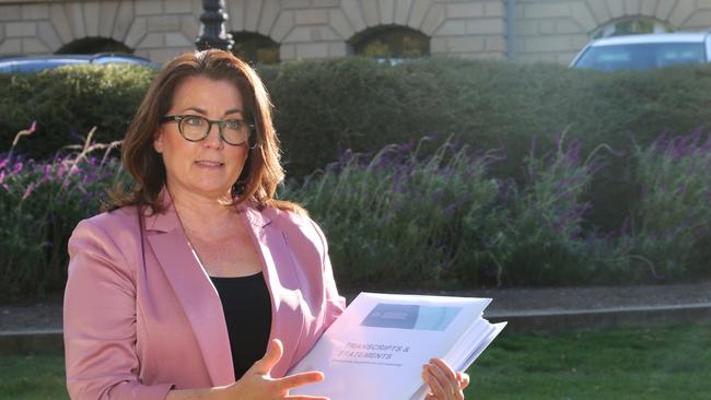 Independent MLC Meg Webb with a dossier of evidence not available to the Blake Review, as she speaks to the media on Parliament Lawns in Hobart on Wednesday, April 17, 2024.