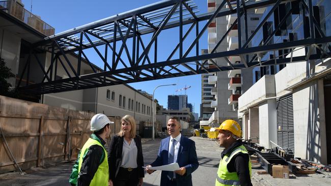 Burwood Mayor John Faker with fellow councillor Heather Crichton and construction workers at the new pedestrian bridge site.