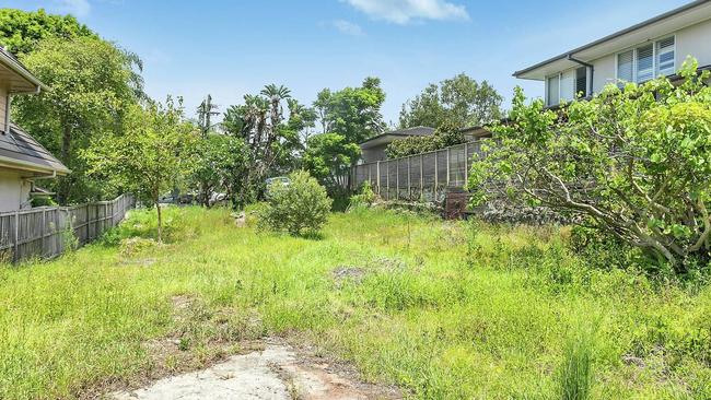 The vacant block of land in Mosman covered in grass, shrubs, and weeds has sold for $8m. Picture: Supplied