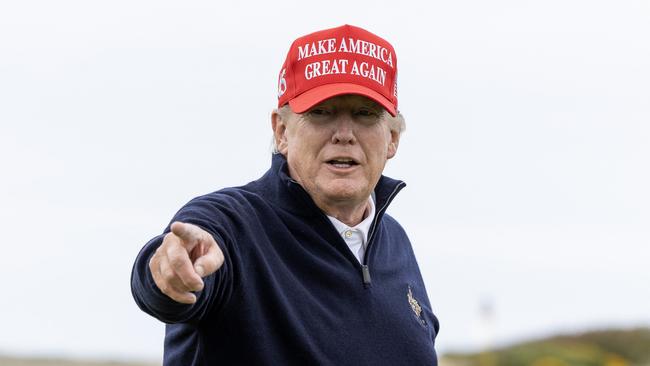 Donald Trump enjoys a round of golf at his Turnberry course in Scotland on Tuesday. Picture: Getty Images