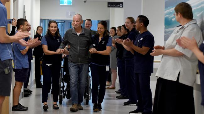 Staff from the infectious diseases ward farewell Paul Faraguna, the last patient coronavirus to leave the Royal Adelaide Hospital. Picture: Naomi Jellicoe