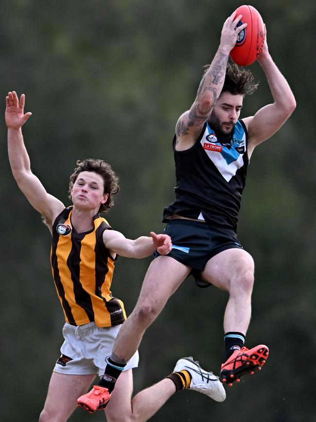 NFL: St Mary’s Jake Dambrauskas marks over Lower Plenty’s Billy Reardon. Picture: Andy Brownbill