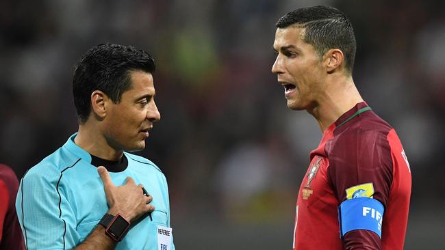 Alireza Faghani has a word with Cristiano Ronaldo at the 2017 Confederations Cup.