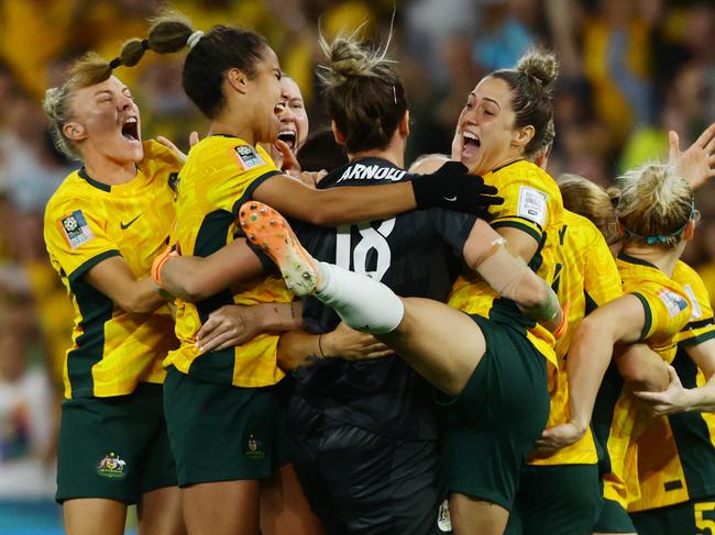 Matildas players celebrate winning the FIFA Womens World Cup Quarter final match between against France at Brisbane Stadium. Picture Lachie Millard