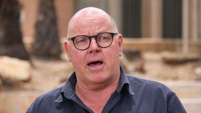 Department of the Chief Minister and Cabinet senior executive director John Gaynor out the front of Alice Springs police station. Picture: Gera Kazakov