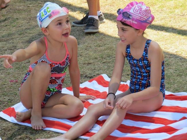 Jewish swimming championships, seven-year-old stars, Randwick's Maya Antonir (left) and Taya Simmons, from Dover Heights take in the atmosphere. Picture: Supplied.