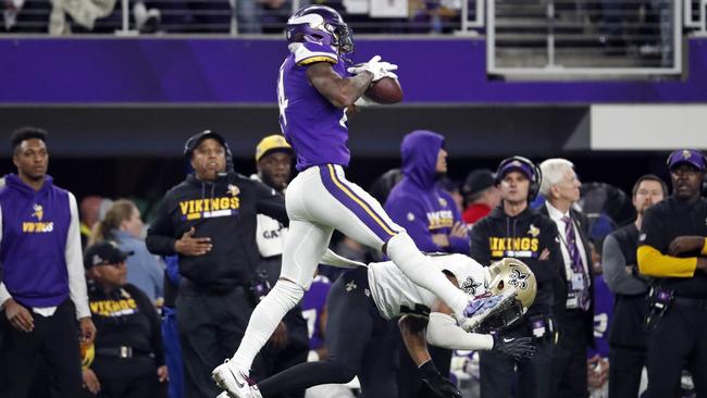 Minnesota Vikings wide receiver Stefon Riggs makes a catch over New Orleans Saints free safety Marcus Williams. (AP Photo/Jeff Roberson)